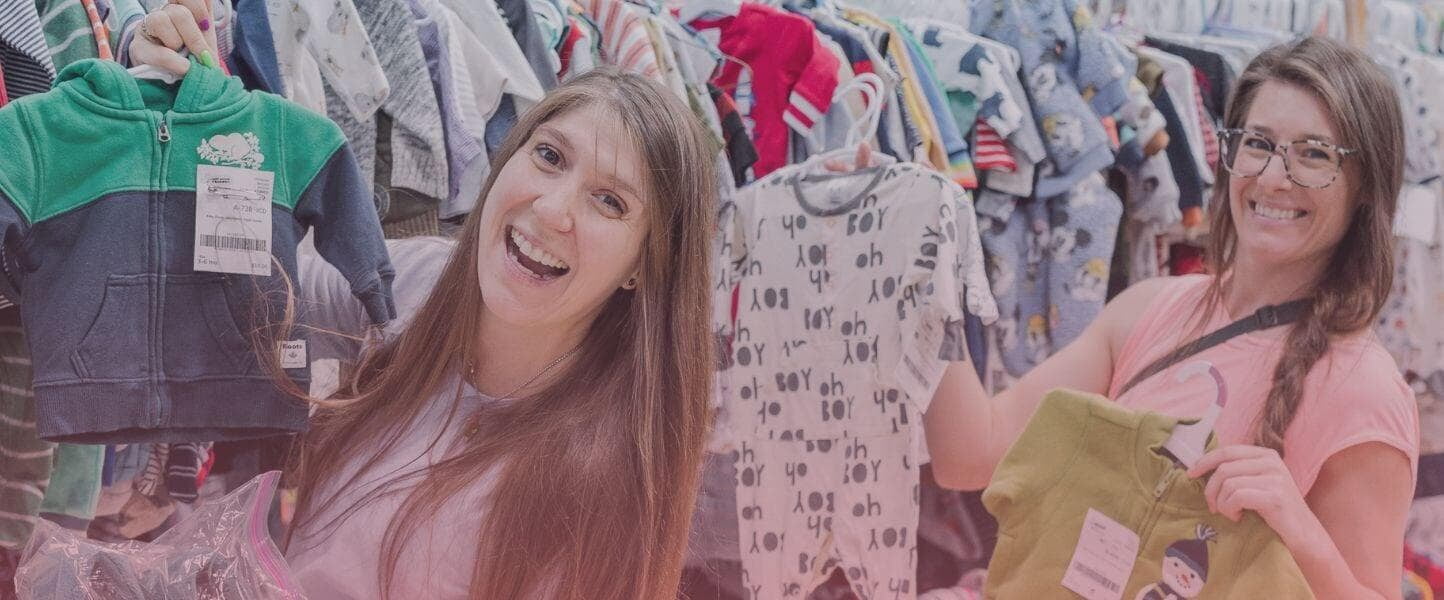 2 friends with boy clothes in aisle